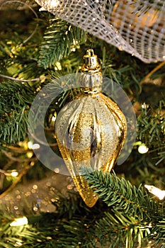 Gold Christmas tree ornament teardrop shape bright and shiney