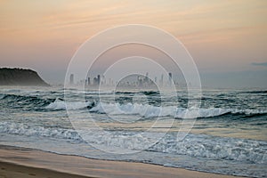 The Gold Coast Skyline in Australia from a Beach at Sunrise