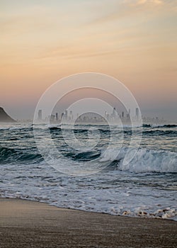 The Gold Coast Skyline in Australia from a Beach at Sunrise