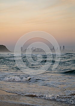 The Gold Coast Skyline in Australia from a Beach at Sunrise