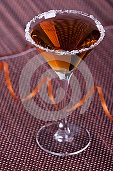 Gold cocktail in martini glass