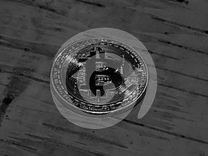Gold coin bitcoin on a black and white background