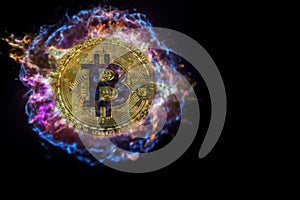 Gold coin of bitcoin explodes and flies into black space.
