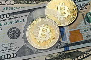 The gold coin of bitcoin lies on on American dollar bills. Online payment technology, digital wallet, computer financial, cryptocu