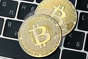 The gold coin of bitcoin lies on the laptop keyboard. Online payment technology, digital wallet, computer financial, cryptocurrenc