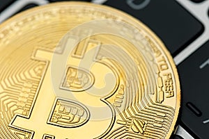 The gold coin of bitcoin lies on the laptop keyboard. Online payment technology, digital wallet, computer financial, cryptocurrenc