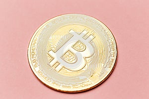 The gold coin of bitcoin on pink background. Online payment technology, digital wallet, computer financial, cryptocurrency trading