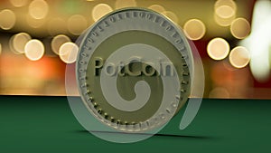 Gold coin with the inscription PotCoin stands on a green cloth, against a background of a holiday.