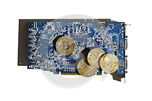 Gold coins with bitcoin symbol lying on blue computer graphic card. Mining virtual crypto currency. Future of finance and payment