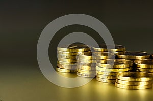 Gold coins on black background. Stack of gold money. Business success concept. A pile of coins.