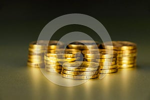 Gold coins on black background. Stack of gold money. Business success concept. A pile of coins.