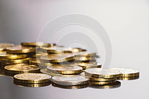 Gold coins on black background. Stack of gold money. Business success concept. A pile of coins.