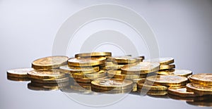 Gold coins on black background. Stack of gold money. Business success concept. A pile of coins.