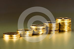 Gold coins on black background. Stack of gold money. Business success concept. A pile of coins. Copy space.