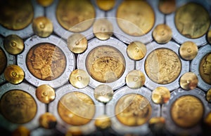 gold coins collectibles background copy space texture with grainy and vintage vignette effect