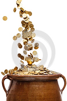 Gold coins falling in the vintage pot