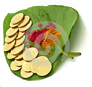 Gold coins kept on betel leaf