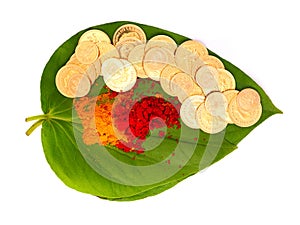 Gold coins kept on betel leaf