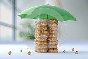 Gold coins protected by an umbrella