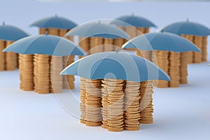 Gold coins protected by umbrellas