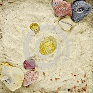 Gold coins in a scenery with sand