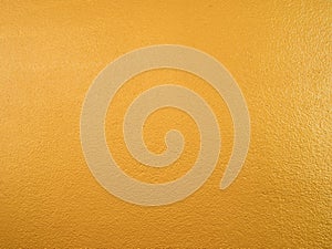 Gold color background. Rough gold texture design on the wall