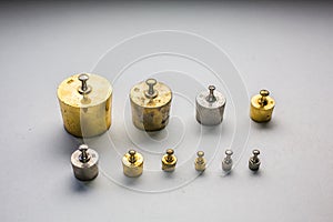 Gold-colored brass weight set
