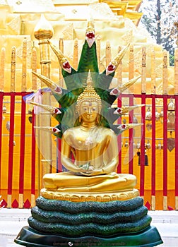 Gold-colored Buddha statue in Buddhist temple