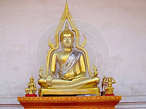 Gold-colored Buddha statue in Buddhist temple