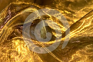 Gold-colored cloth as a background for a card