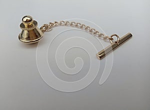 Gold colored metal chain with pendulum and pedicle handles photo