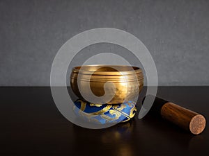 Tibetan singing bowl and striker with copy space photo