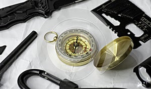 Gold compass with survival kit