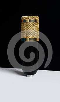 Gold condensor Mic on white background