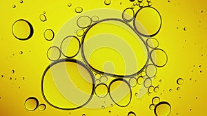 Gold cosmetic oil seamless loop 4k. Essential oil abstract closeup of yellow cosmetic oil golden background. Clean