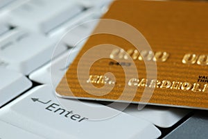 Gold Credit Card on a Keyboard