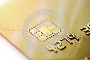 Gold credit card with micro chip selective focus