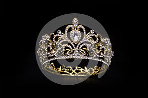 Gold crown with diamonds isolated on black