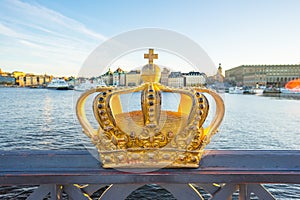 Gold crown on skeppsholmen bridge in Stockholm city, Sweden