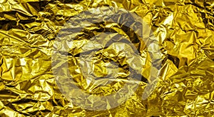 Gold crumpled aluminum foil texture background