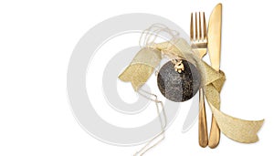 Gold cutlery and Christmas bauble decoration isolated on white