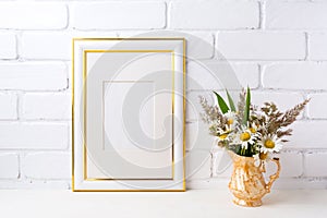 Gold decorated frame mockup with chamomile and grass in golden v