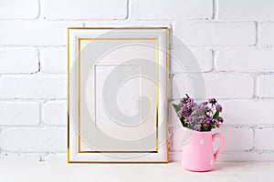 Gold decorated frame mockup with purple flowers in pink rustic p