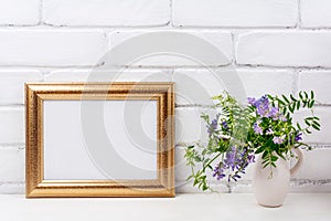 Gold decorated landscape frame mockup with bird vetch