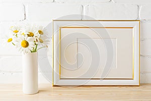 Gold decorated landscape frame mockup with daisy flower in vase