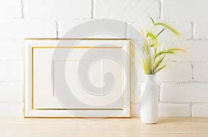 Gold decorated landscape frame mockup with green wild grass ears