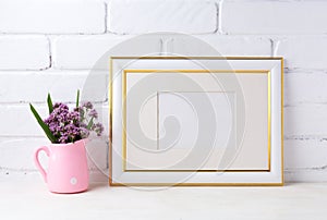 Gold decorated landscape frame mockup with purple flowers in pin