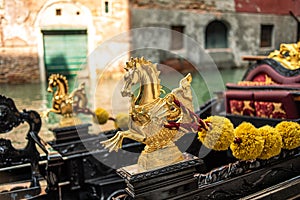 Gold decoration on the gondola. Detail Venetian Gondola Stern Detail or Ornament on the Grand Canal in Venice