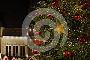 Gold decorative star on Christmas tree