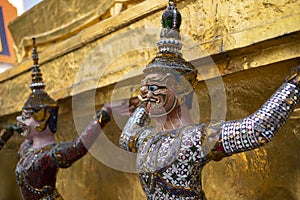 Gold demons guard facades and entrances at Grand Palace, Bangkok, Thailand